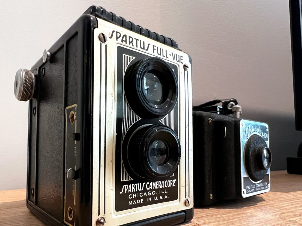 Closeup photo of two vintage cameras at SquirrelHaus PEC
