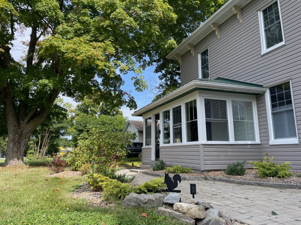A photo of the front of SquirrelHaus PEC in summer